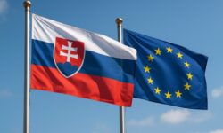 Die Flaggen der Slowakei und der Europäischen Union wehen Seite an Seite vor blauem Himmel. Symbol für die wiederhergestellte Einigkeit in der Sanktionsfrage.